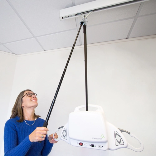 Woman putting away ceiling hoist